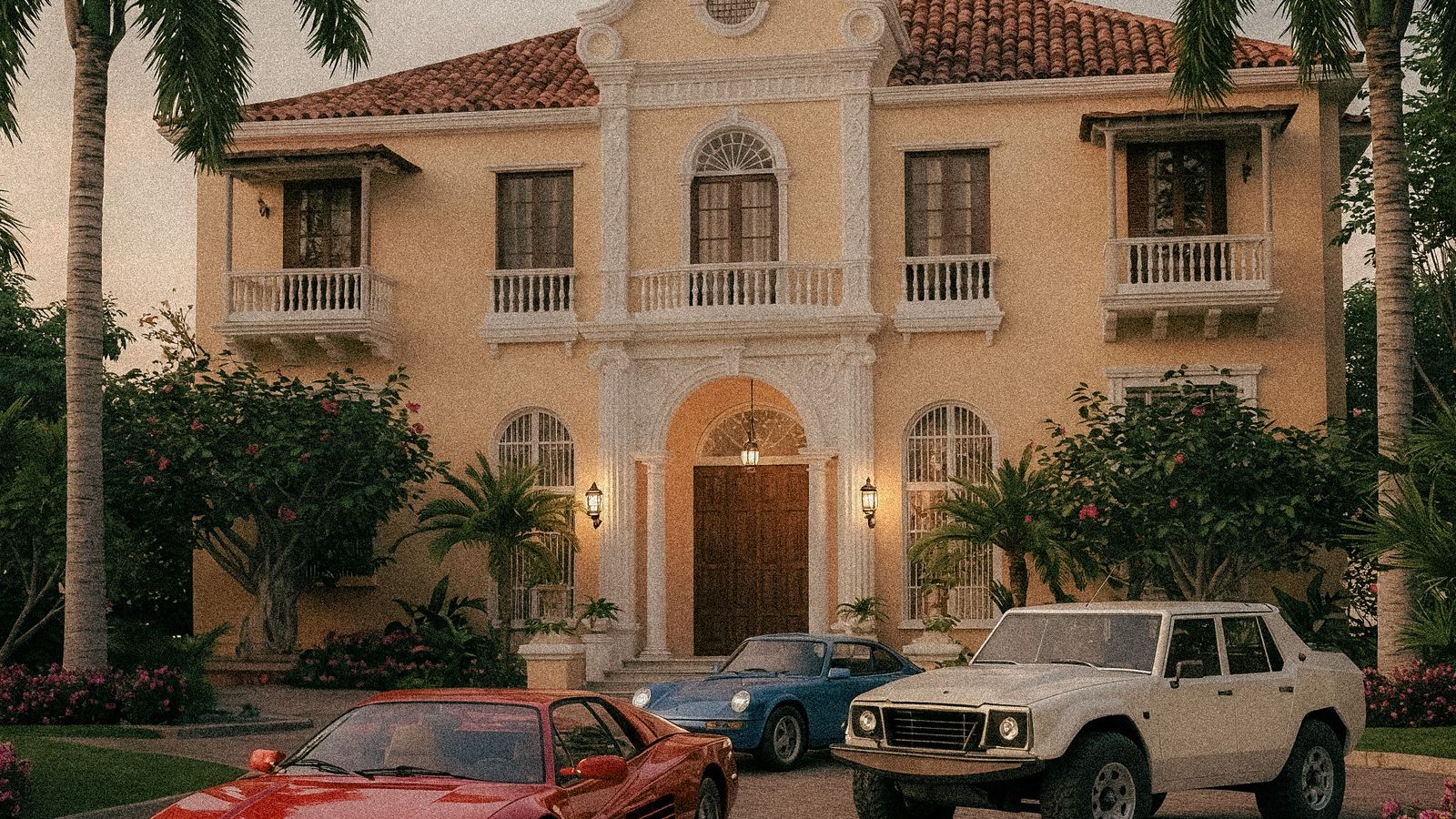 Voitures de luxe garées devant une villa de style méditerranéen.